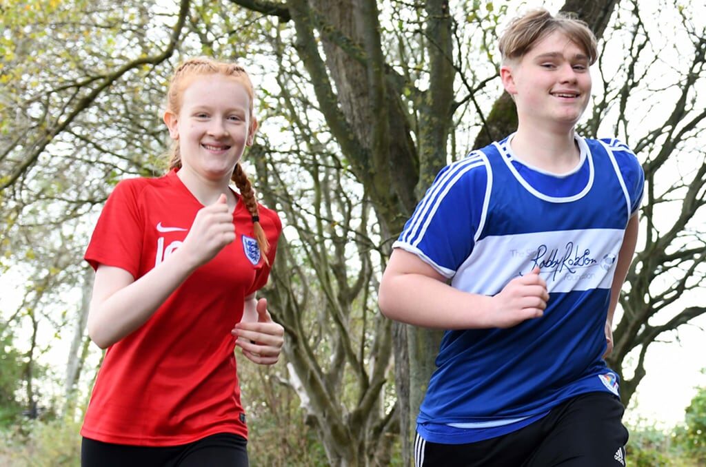 Girl and boy in ENgland and Sir Bobby vest running